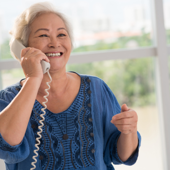 Woman talking on the phone with a support expert